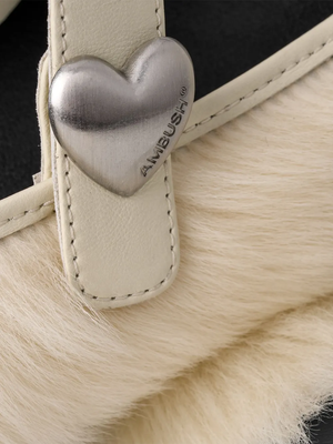 Close up of white shoes, showing texture of the sheepskin fabric