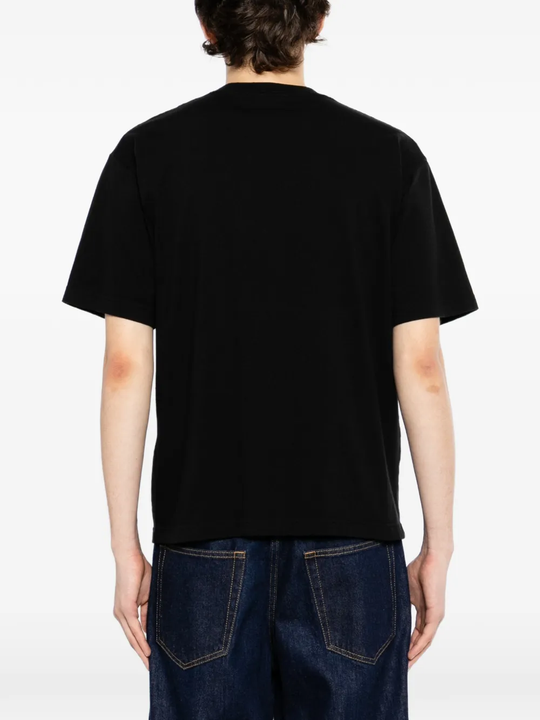 Black t-shirt worn by a person, showing the t-shirt fit