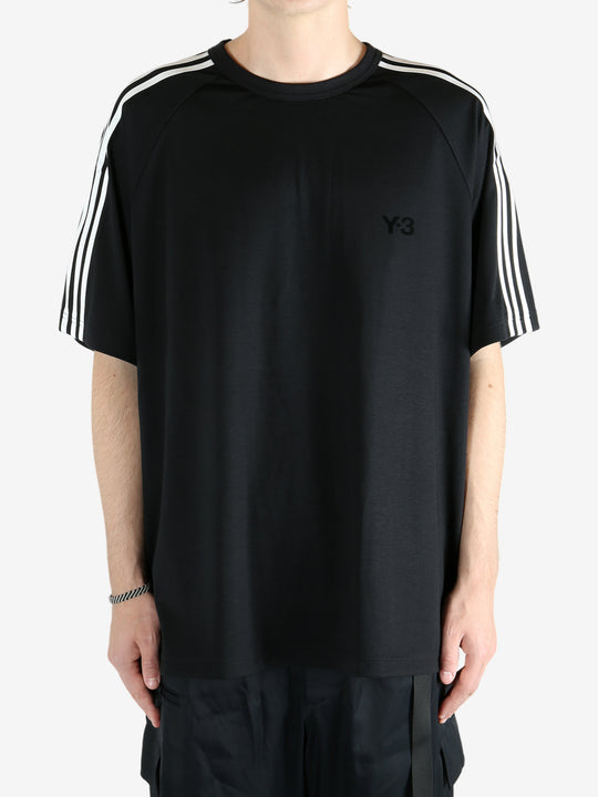 Black t-shirt worn by a person, showing the shirt's fit