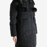 Black parka worn by a person, showing the parka fit