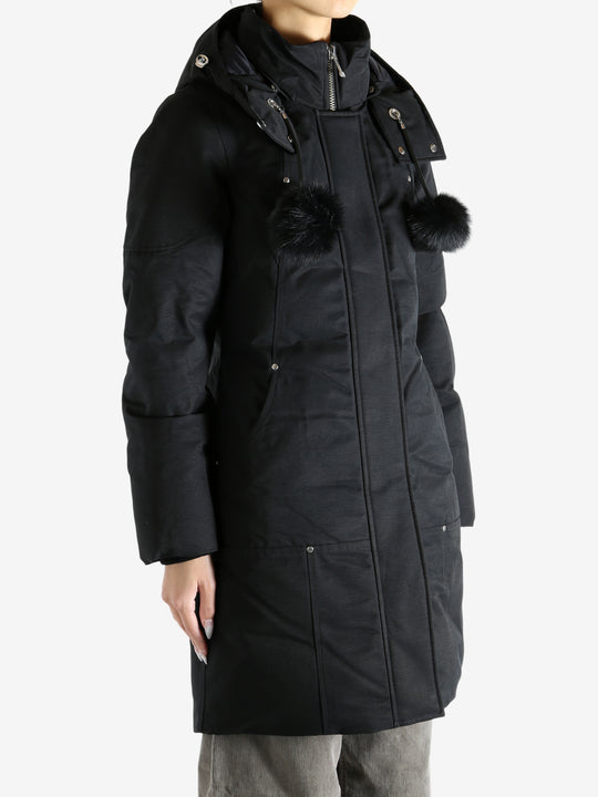 Black parka worn by a person, showing the parka fit