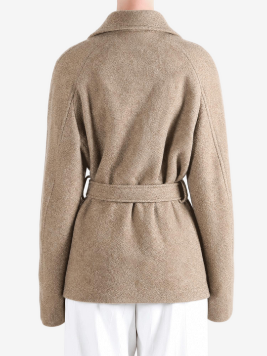 Tan jacket worn by a person, showing the jacket fit