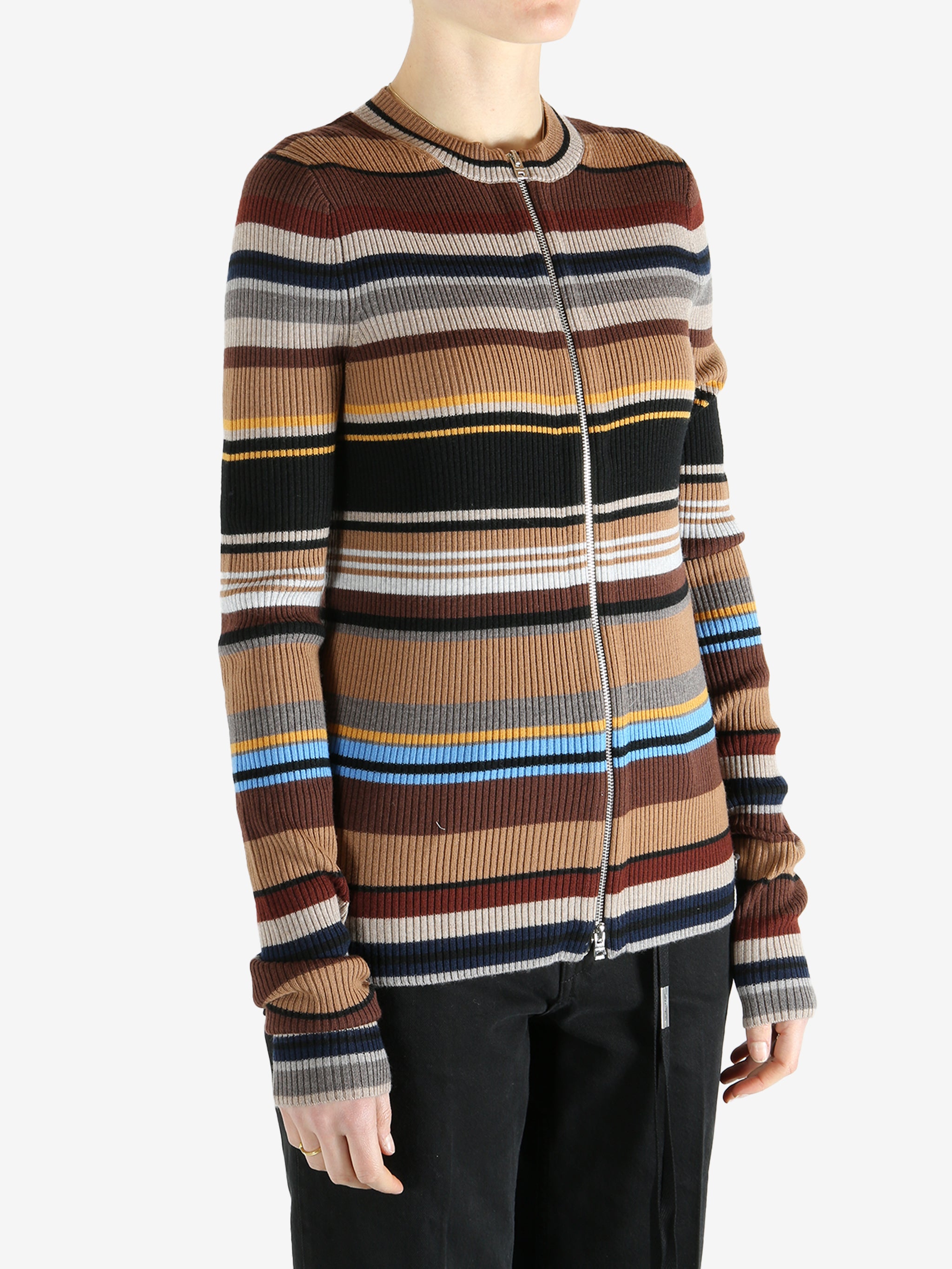 Brown sweater worn by a person, showing the sweater fit