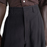 Close up of black pants, showing texture of the viscose and flax fabric