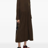 Brown dress worn by a person, showing the dress's fit