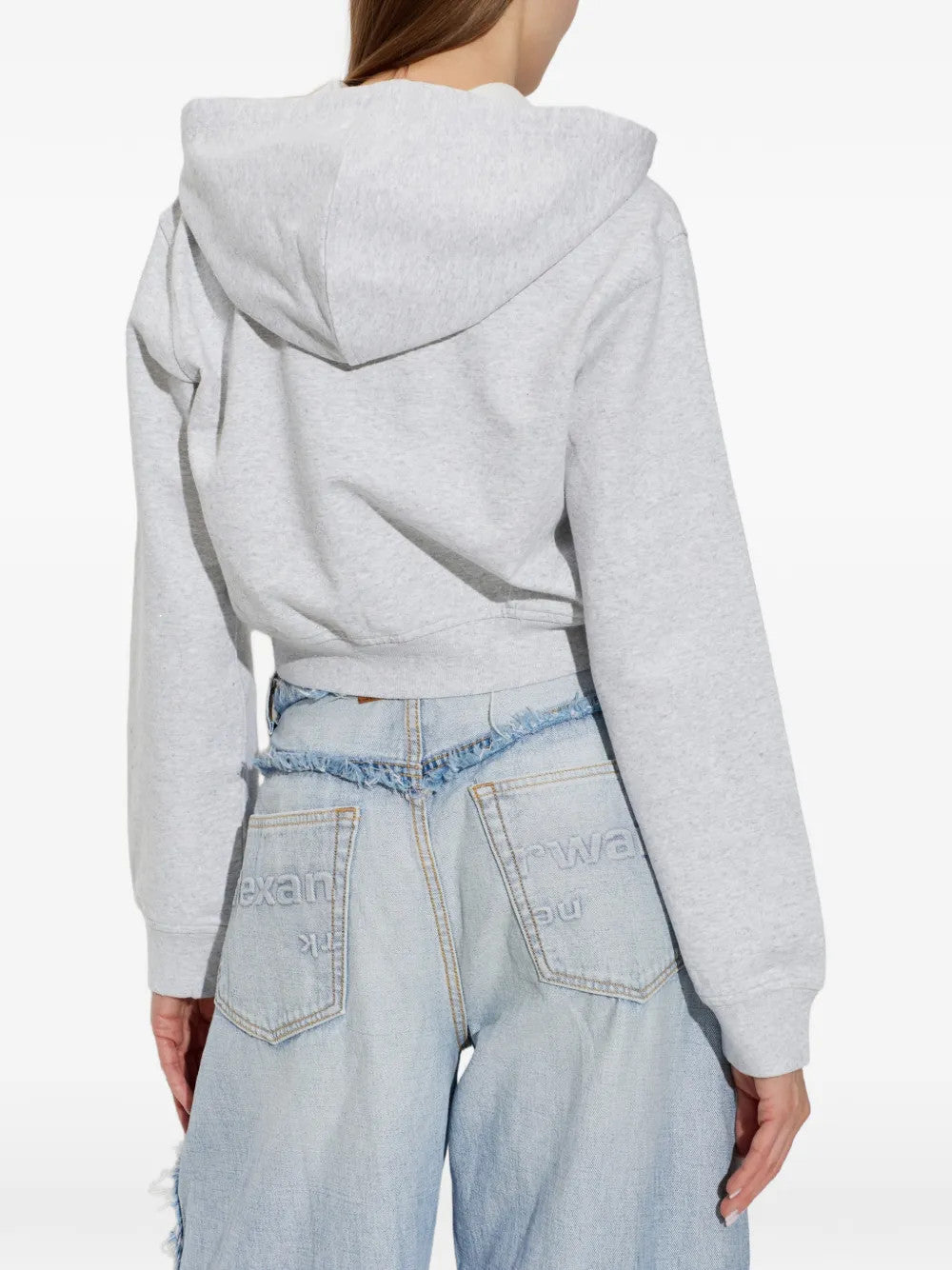 Grey top worn by a person, showing the top fit