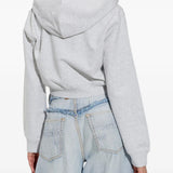 Grey top worn by a person, showing the top fit