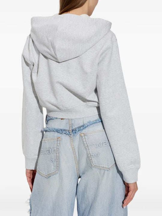 Grey top worn by a person, showing the top fit