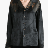 Black shirt worn by a person, showing the shirt's fit