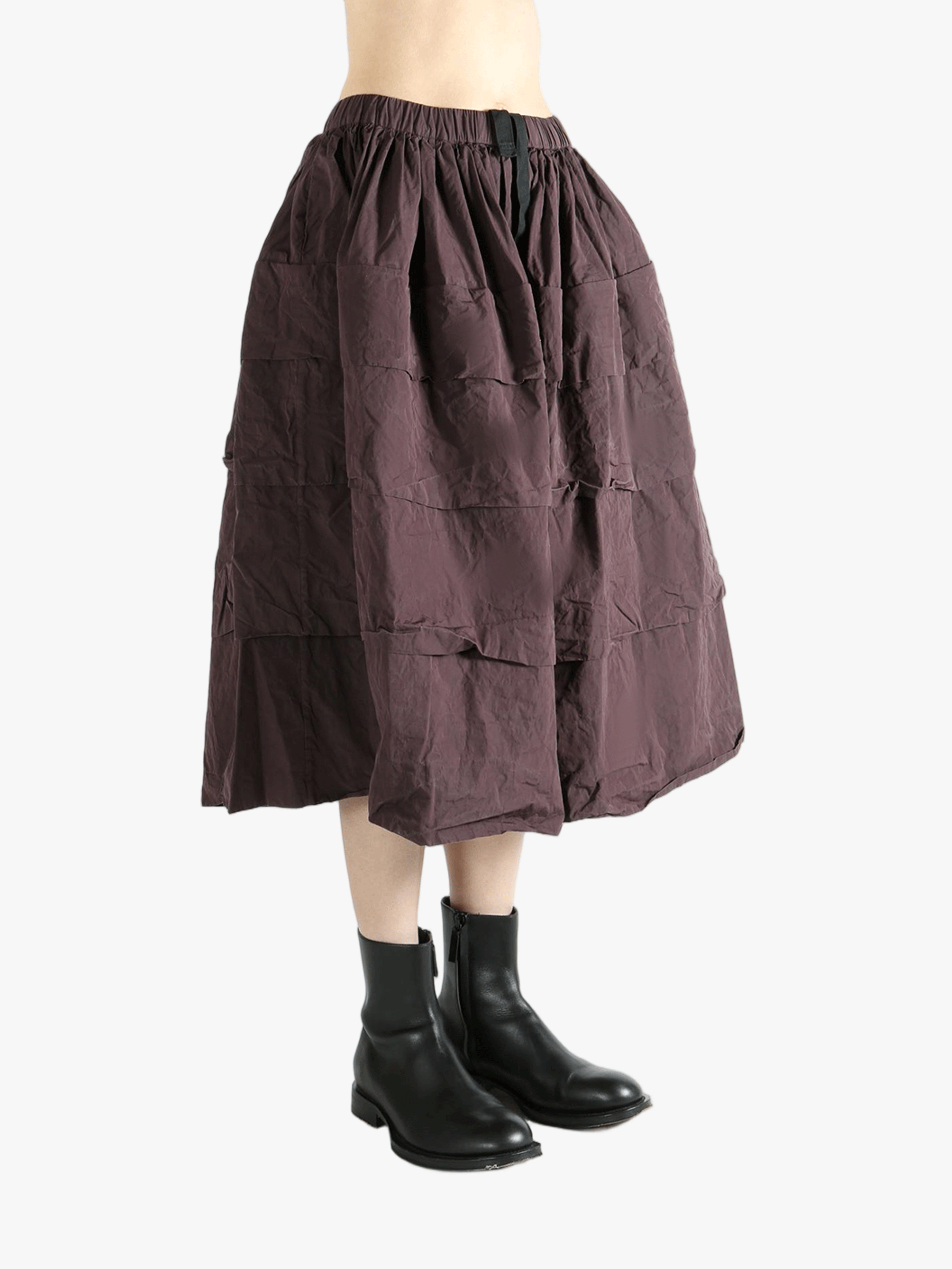 Brown skirt worn by a person,showing the skirt fit