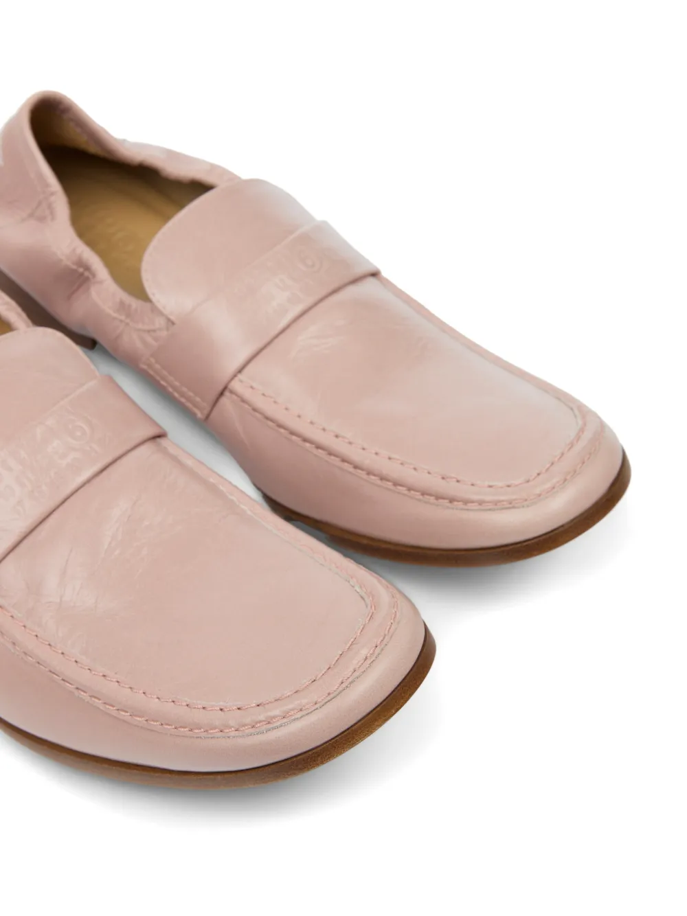 Close up of pink loafers, showing texture of the Calf Leather fabric