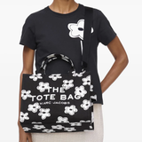 Black bag worn by a person, showing the bag's fit