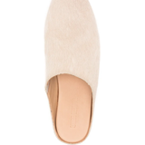 Close up of tan top,showing texture of the cotton fabric.