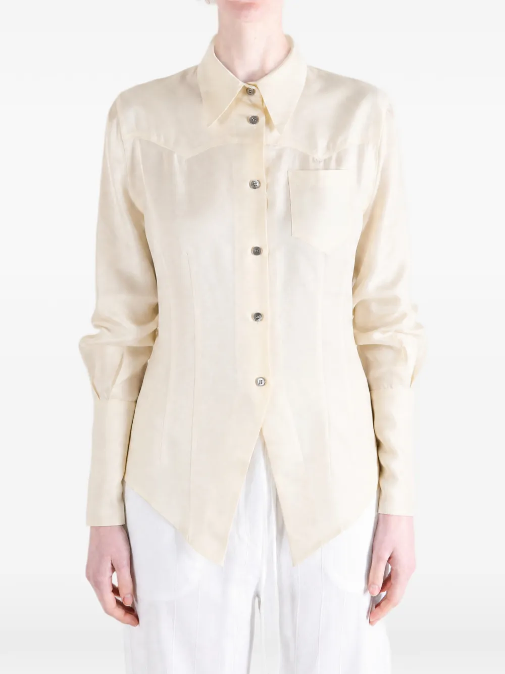 Tan shirt worn by a person, showing the shirt fit