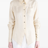 Tan shirt worn by a person, showing the shirt fit