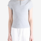 Grey shirt worn by a person, showing the shirt fit
