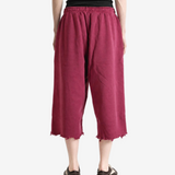 Burgundy pants, full body view