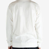 White crewneck worn by a person, showing the crewneck fit