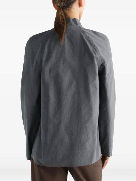 Grey dress worn by a person, showing the dress fit