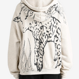Tan hoodie worn by a person, showing the hoodie fit
