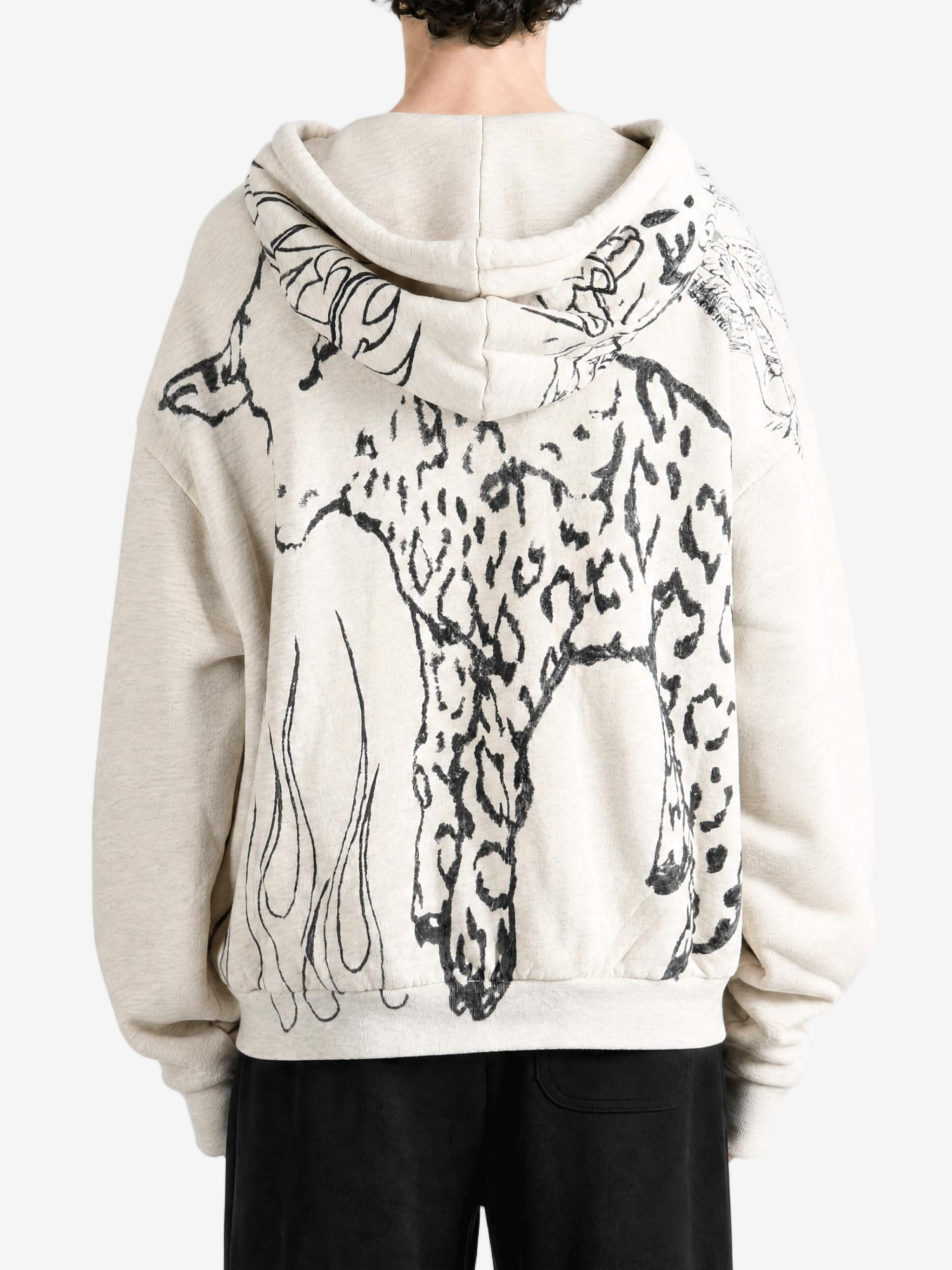 Tan hoodie worn by a person, showing the hoodie fit