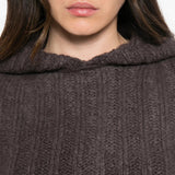 Brown knitwear worn by a person, showing the knitwear fit