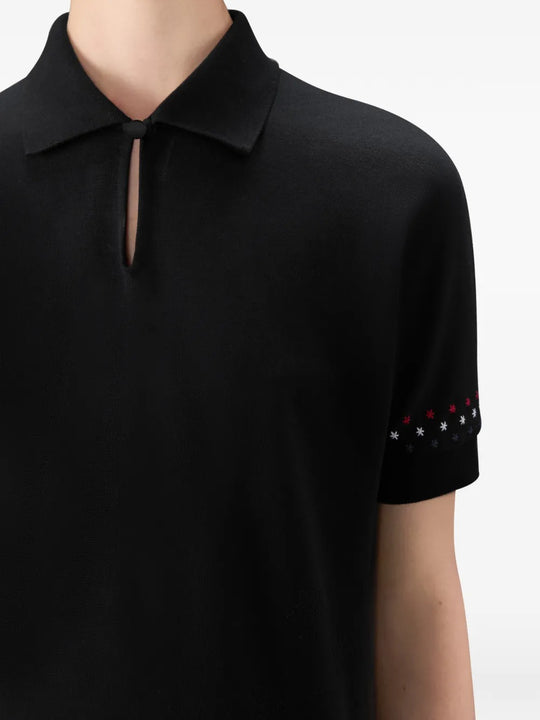 Close up of black t-shirt, showing texture of the cotton fabirc