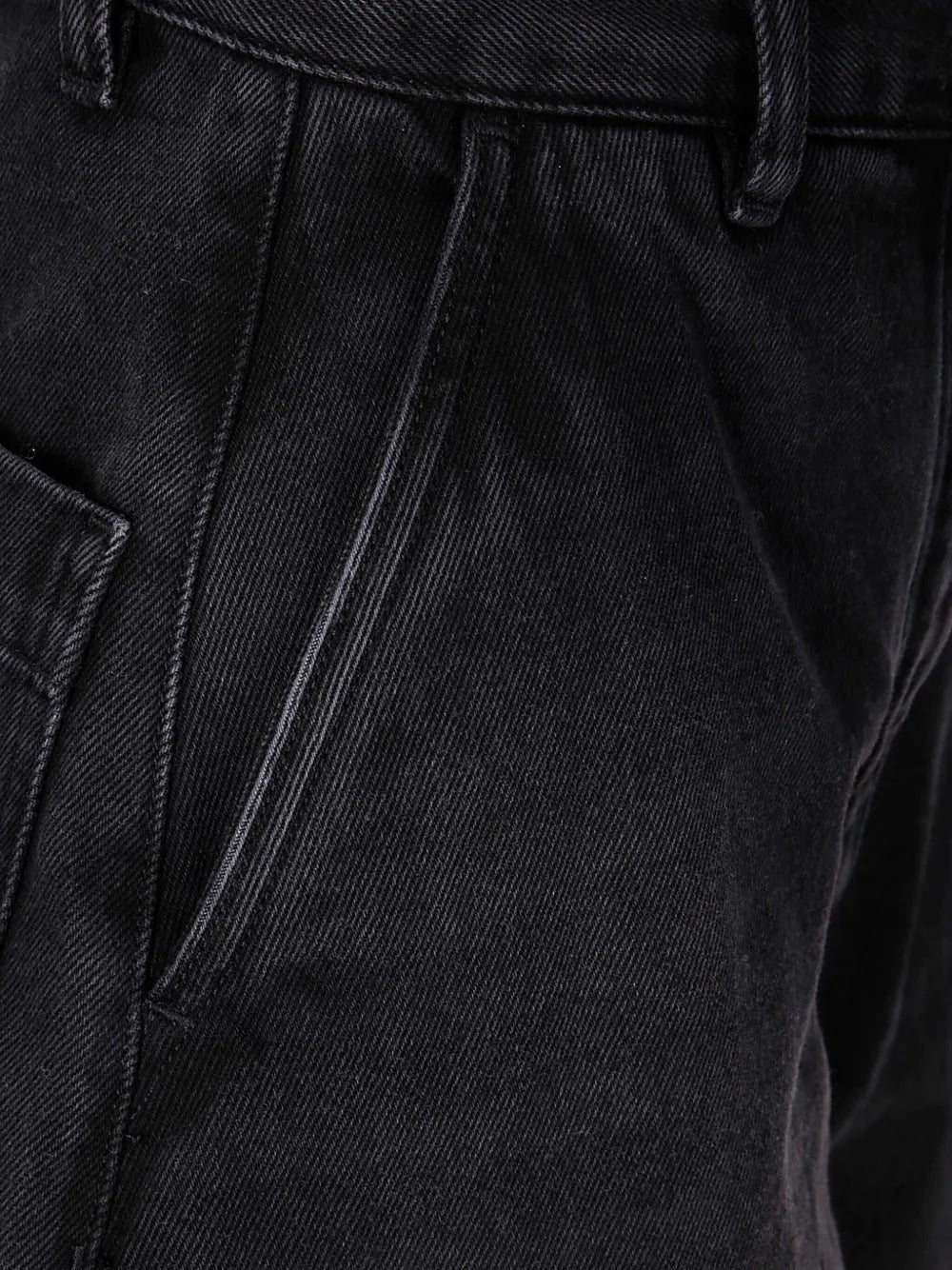 Close up of black pants, showing texture of the cotton fabric