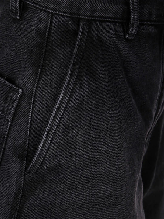 Close up of black pants, showing texture of the cotton fabric