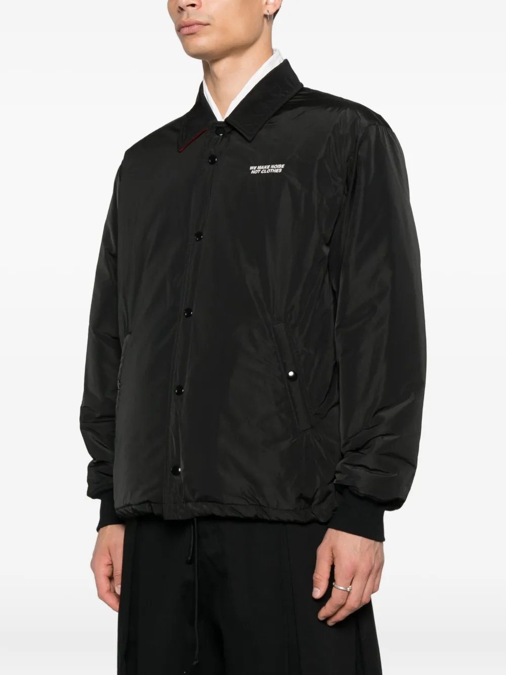 Black jacket worn by a person, showing the jacket's fit