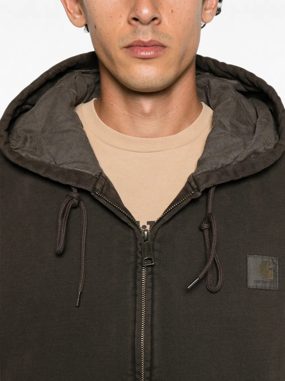 Brown jacket worn by a person, showing the jacket fit