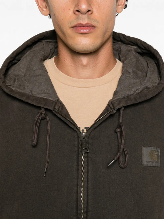 Brown jacket worn by a person, showing the jacket fit