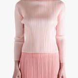 Pink shirt worn by a person, showing the shirt's fit