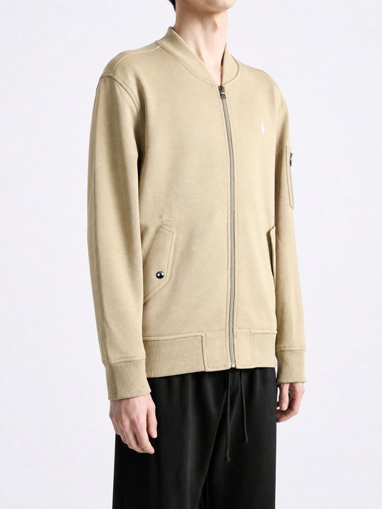 Tan jacket worn by a person, showing the jacket fit