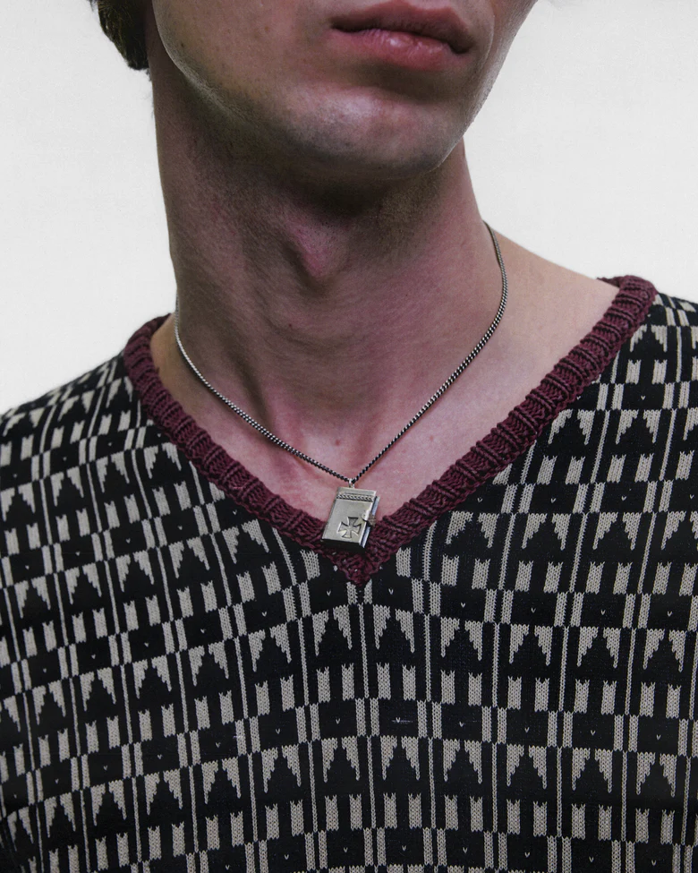 Grey jewelry worn by a person, showing the jewelry fit
