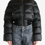 Black jacket worn by a person, showing the jacket fit