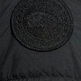 Close up of the black jacket, showing texture of the polyamide fabric