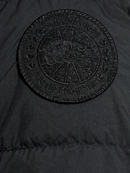Close up of the black jacket, showing texture of the polyamide fabric