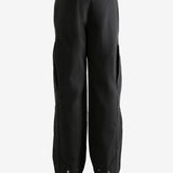 Black  pant worn by a person, showing the pant's fit