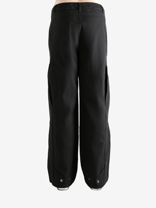 Black  pant worn by a person, showing the pant's fit