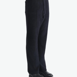 Navy pants worn by a person, showing the pants fit