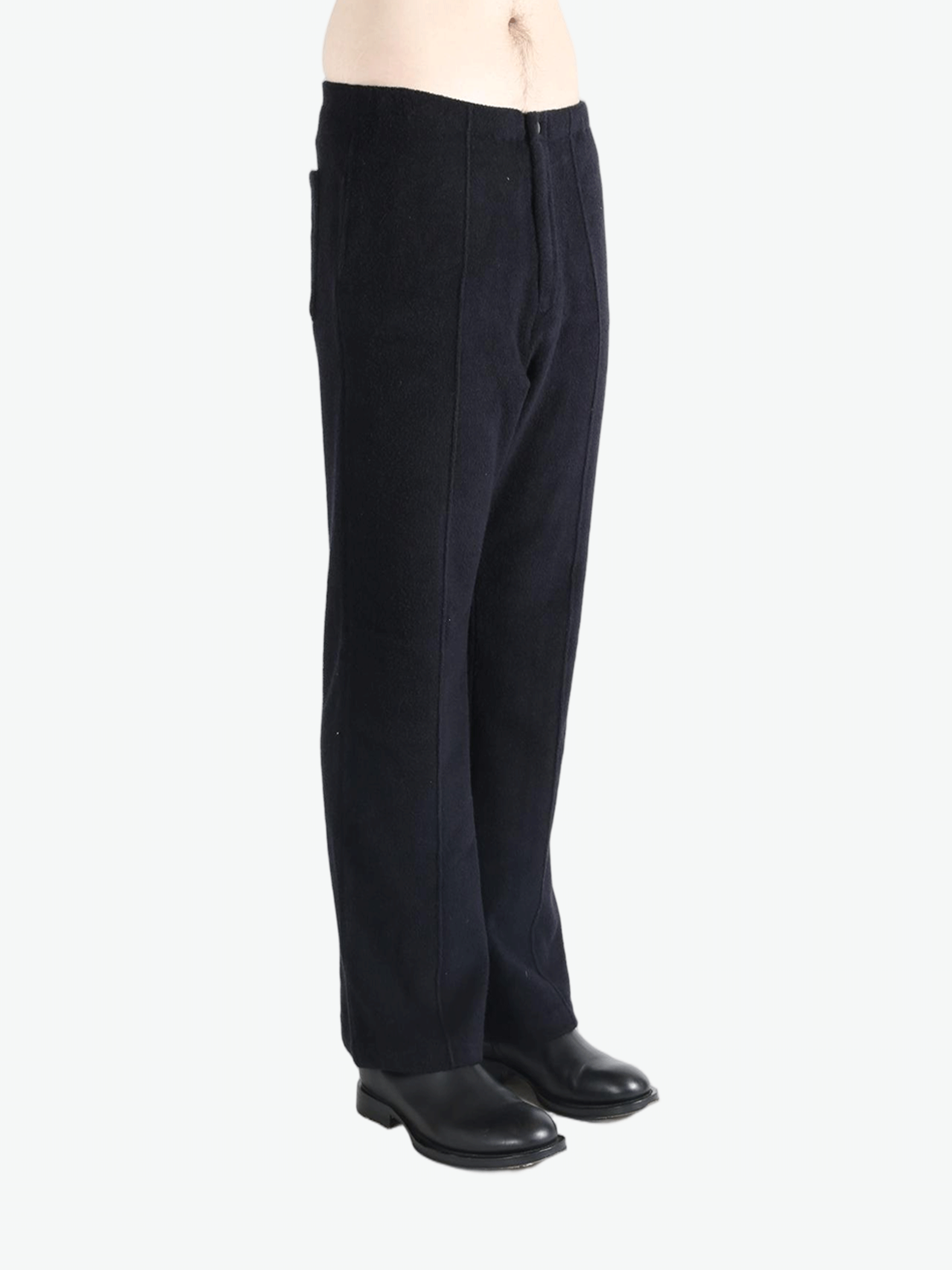 Navy pants worn by a person, showing the pants fit