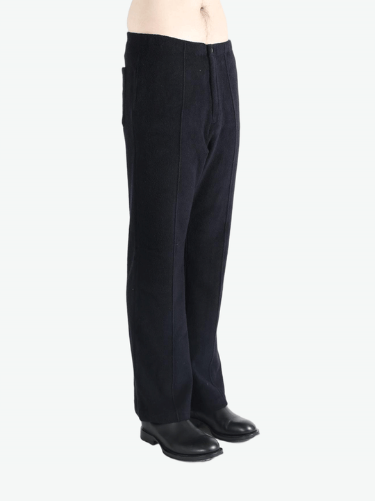 Navy pants worn by a person, showing the pants fit