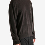 Brown sweater worn by a person, showing the sweater's fit