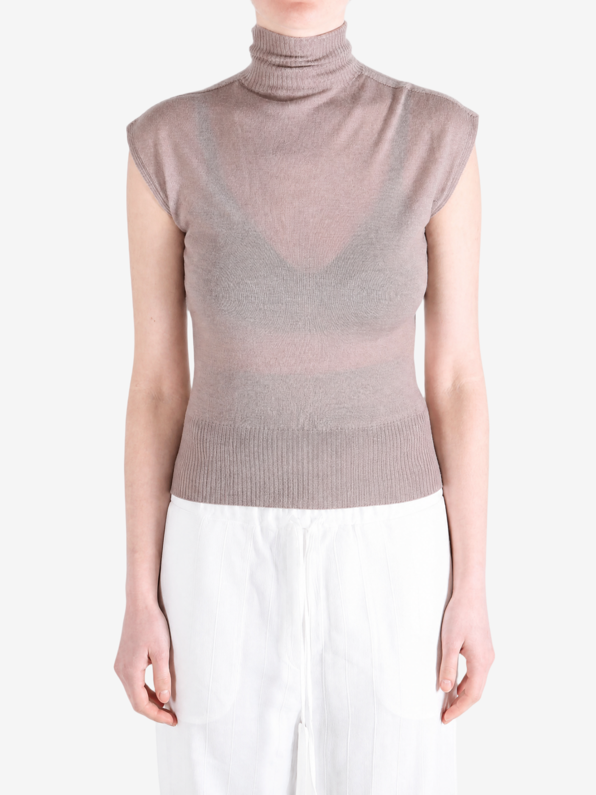 Brown top worn by a person, showing the top fit