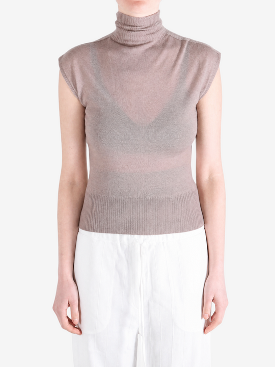 Brown top worn by a person, showing the top fit