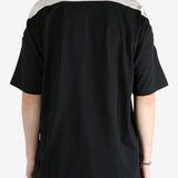 Black t-shirt worn by a person, showing the shirt's fit