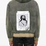 Green jacket worn by a person, showing the jacket fit