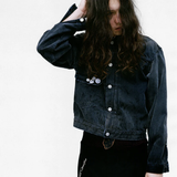 Grey jacket worn by a person, showing the jacket's fit