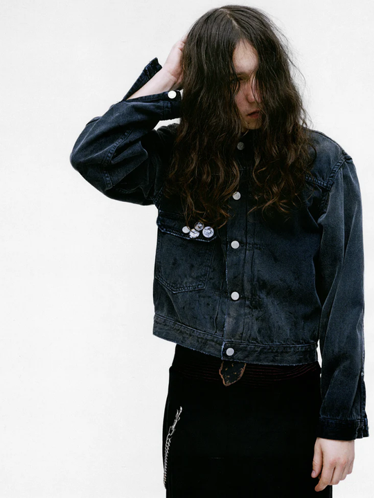 Grey jacket worn by a person, showing the jacket's fit